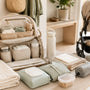 Organized diaper backpack with baby essentials and stroller ready for a family day out