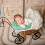 sleeping baby in old stroller