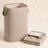 Oatmeal nursery laundry hamper shown open and folded