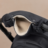 Cream fleece lining, snaps and elastic cuffs inside the hand muff