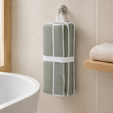 Folded baby bath kneeler and elbow rest hanging to air dry