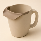 Sand-beige baby bath rinse cup with soft flexible forehead rim