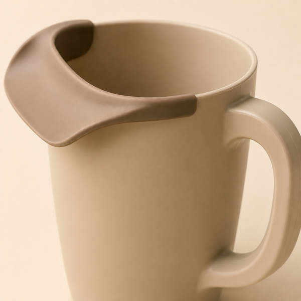 Close view of flexible soft rim, waterfall spout and easy-grip handle