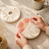 Adult hands placing a gel comfort pack into its soft washable sleeve
