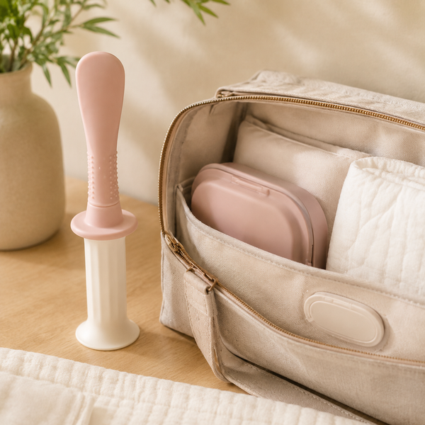 Mini applicator case packed in a diaper bag beside the full-size applicator