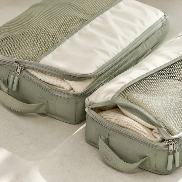 Close-up of packing cube mesh zippers seams and carry handles