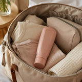 Blush pink peri rinse bottle packed neatly in a neutral hospital bag