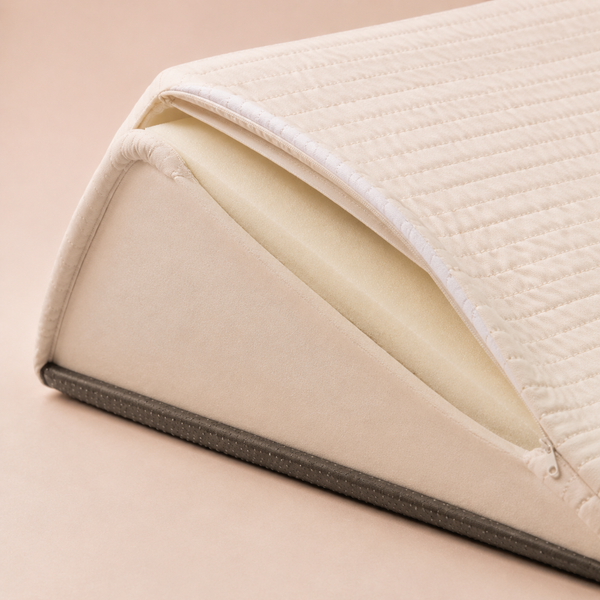 Unzipped quilted cover revealing foam core and non-slip base