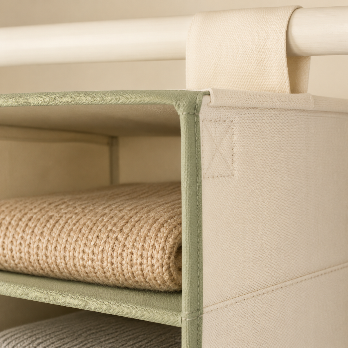 Close-up of reinforced sage trim and wide hanging strap
