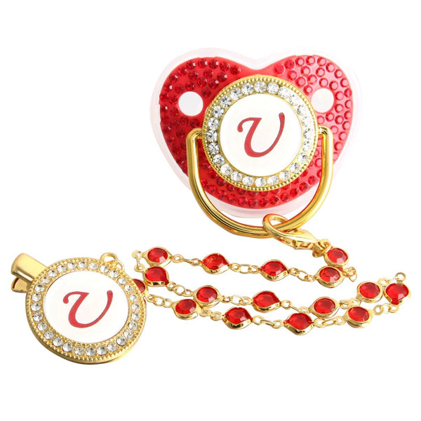 Red and gold initial U pacifier with matching decorative clip