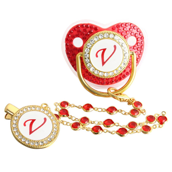 Red and gold initial V pacifier with matching decorative clip