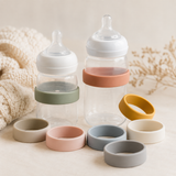 Eight muted rainbow silicone identification bands with baby bottles