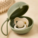 Close-up of an open sage silicone pacifier case