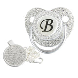 Silver initial B bling pacifier with matching round decorative clip