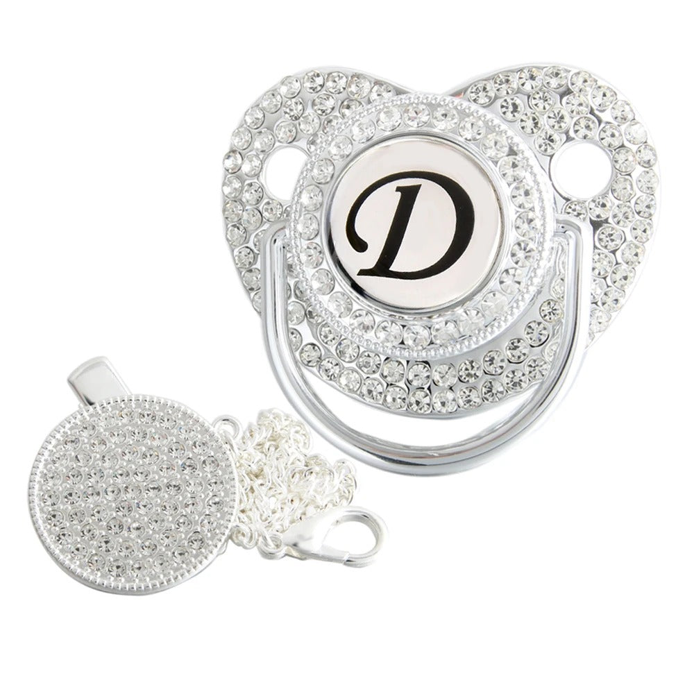 Silver initial D bling pacifier with matching round decorative clip