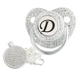 Silver initial D bling pacifier with matching round decorative clip