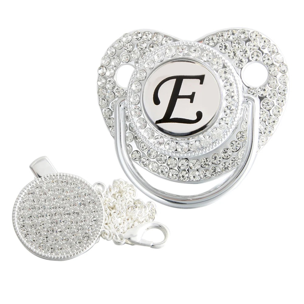 Silver initial E bling pacifier with matching round decorative clip