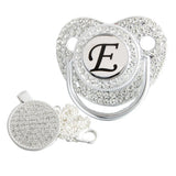 Silver initial E bling pacifier with matching round decorative clip