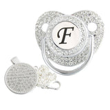 Silver initial F bling pacifier with matching round decorative clip