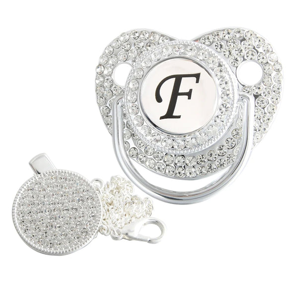 Silver initial F bling pacifier with matching round decorative clip