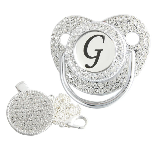 Silver initial G bling pacifier with matching round decorative clip