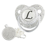 Silver initial L bling pacifier with matching round decorative clip