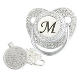 Silver initial M bling pacifier with matching round decorative clip