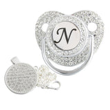 Silver initial N bling pacifier with matching round decorative clip