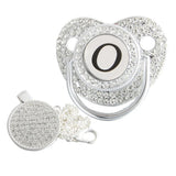 Silver initial O bling pacifier with matching round decorative clip
