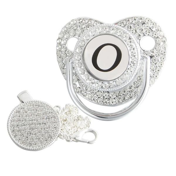 Silver initial O bling pacifier with matching round decorative clip