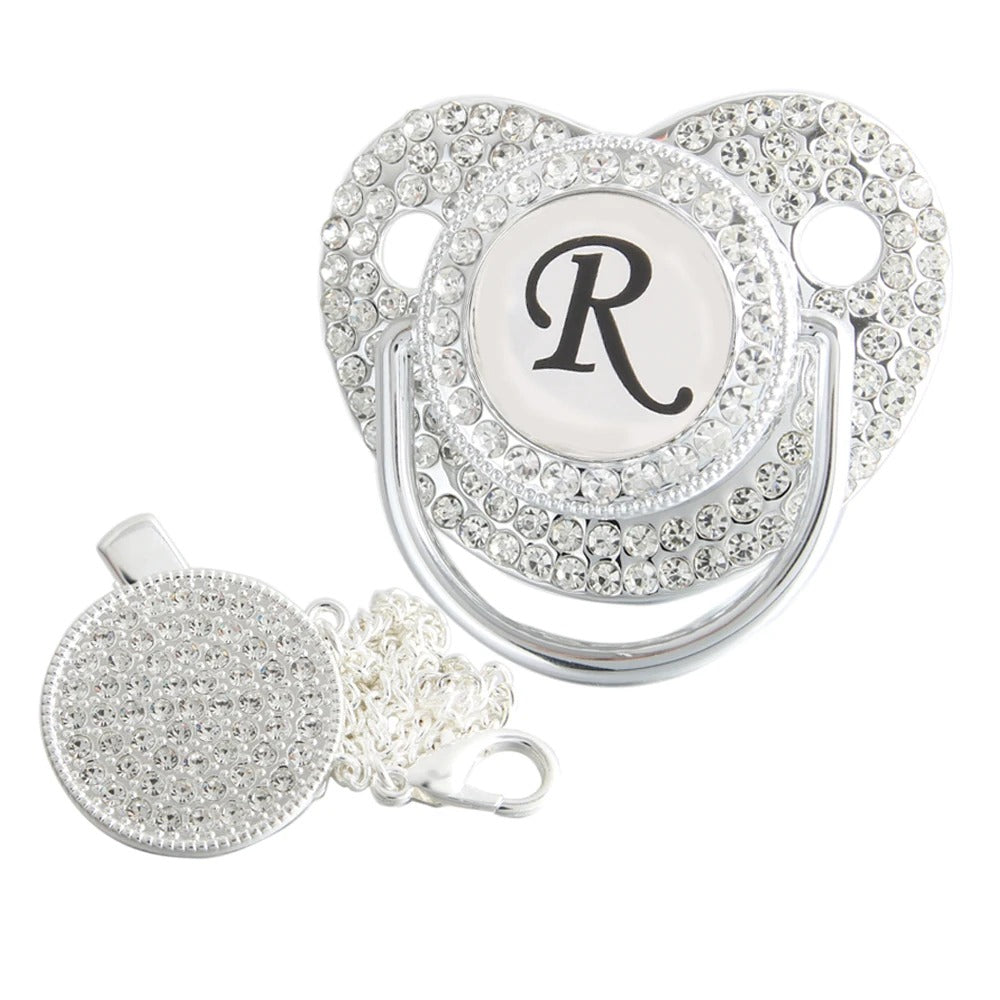 Silver initial R bling pacifier with matching round decorative clip