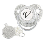 Silver initial V bling pacifier with matching round decorative clip