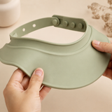 Adult hands flexing the soft brim and showing the adjustable closure