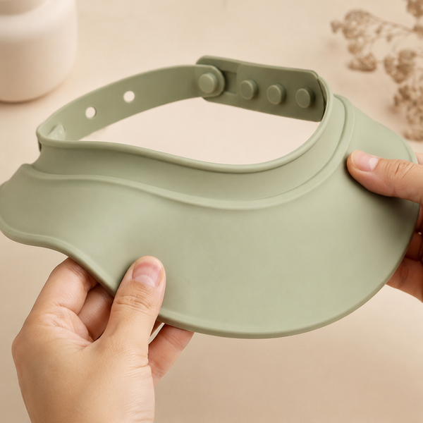Adult hands flexing the soft brim and showing the adjustable closure
