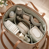 Organizer insert fitted inside a tote with diapering essentials