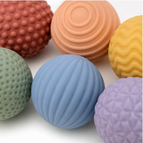 Close view of six distinct sensory ball textures