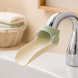 Close-up of faucet extender securely fitted to a curved tap