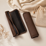 Two cocoa stroller grip covers arranged with a mesh wash bag