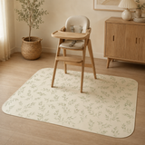 Sage leaf waterproof splat mat beneath a wooden high chair